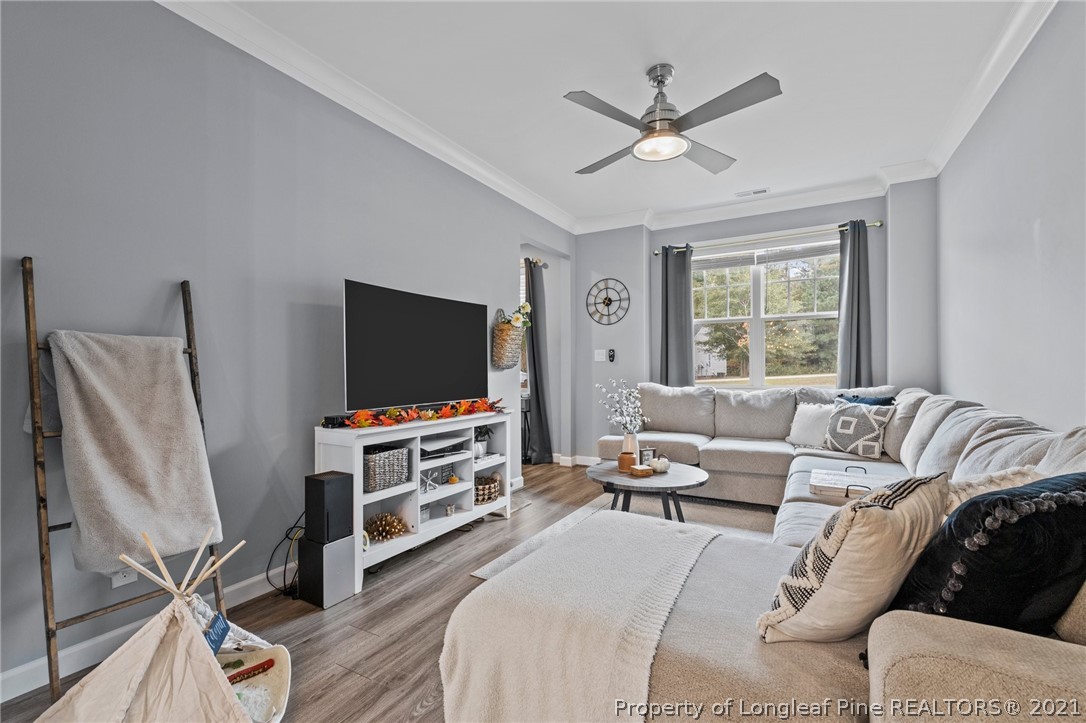 171 Apache Trail Sanford, NC 27332 - Photo 12 of 38 a living room with furniture and a flat screen tv
