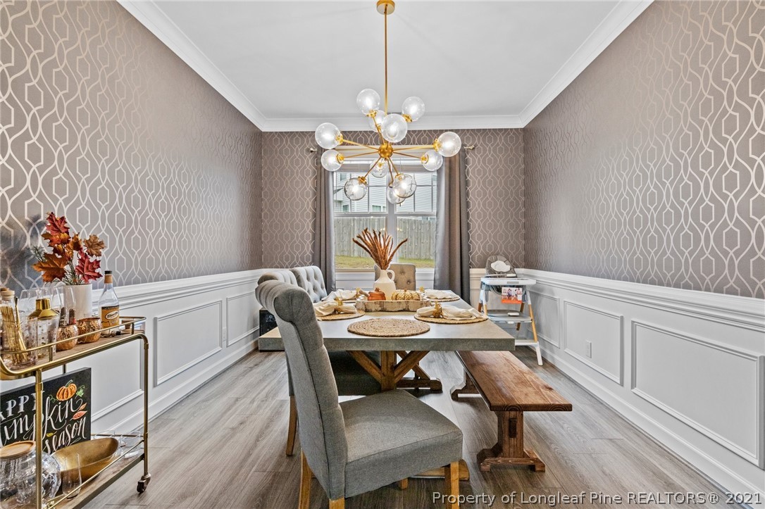 171 Apache Trail Sanford, NC 27332 - Photo 13 of 38 a view of a dining room with furniture window and wooden floor