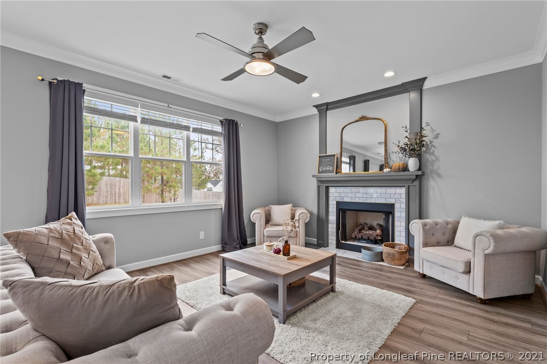 171 Apache Trail Sanford, NC 27332 - Photo 21 of 38 a living room with furniture and a fireplace