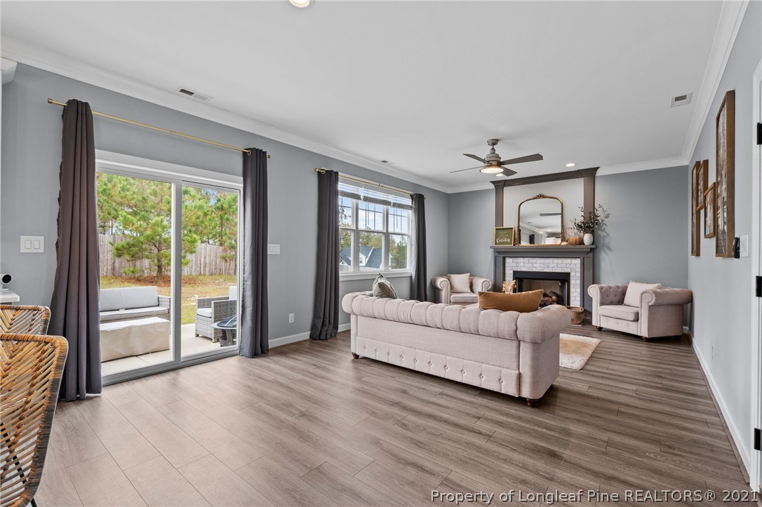 171 Apache Trail Sanford, NC 27332 - Photo 22 of 38 a living room with furniture and a fireplace