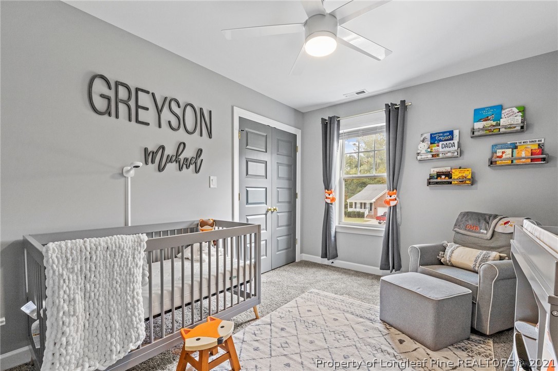 171 Apache Trail Sanford, NC 27332 - Photo 33 of 38 a bedroom with furniture and a window