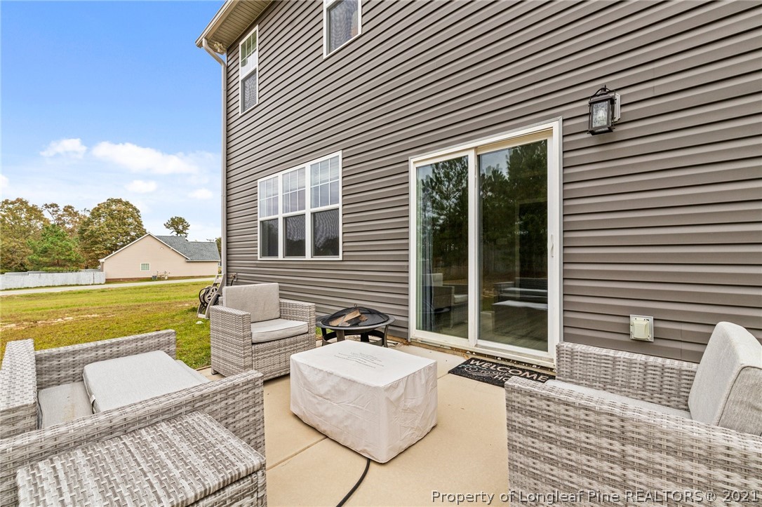 171 Apache Trail Sanford, NC 27332 - Photo 36 of 38 a view of a house with a lounge chair