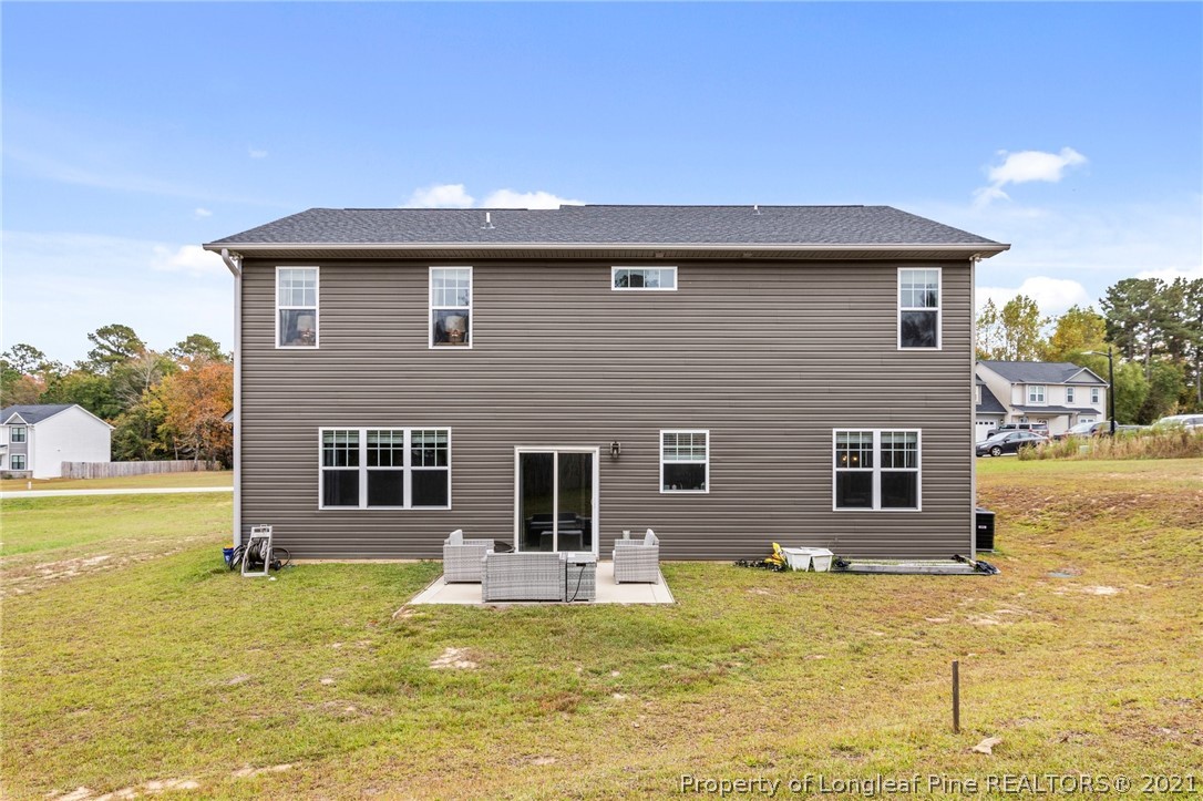171 Apache Trail Sanford, NC 27332 - Photo 37 of 38 a front view of a house with a yard
