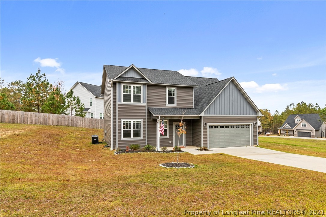 171 Apache Trail Sanford, NC 27332 - Photo 4 of 38 a front view of a house with swimming pool