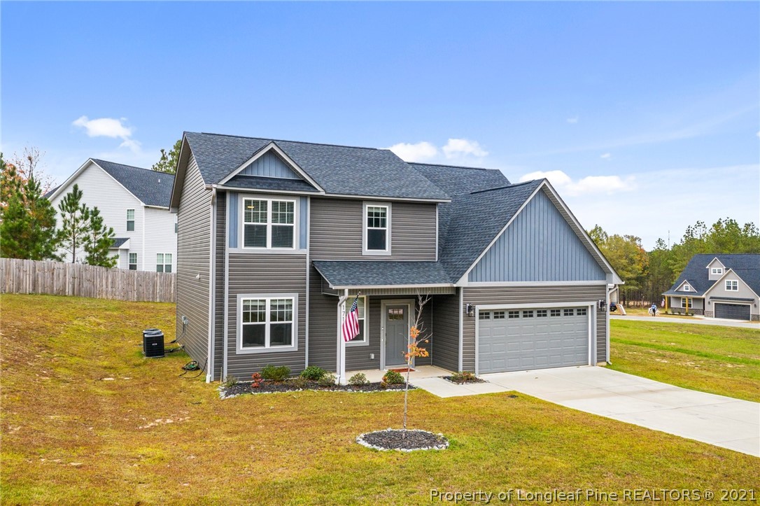 171 Apache Trail Sanford, NC 27332 - Photo 5 of 38 a front view of a house with a yard