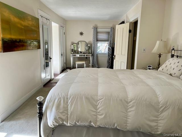 47 Mine Hill Road Cornwall, NY 12518 - Photo 17 of 45 a spacious bedroom with a bed and a view of bathroom