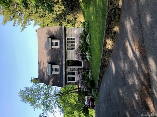 47 Mine Hill Road Cornwall, NY 12518 - Photo 2 of 45 a front view of a house with a garden and trees