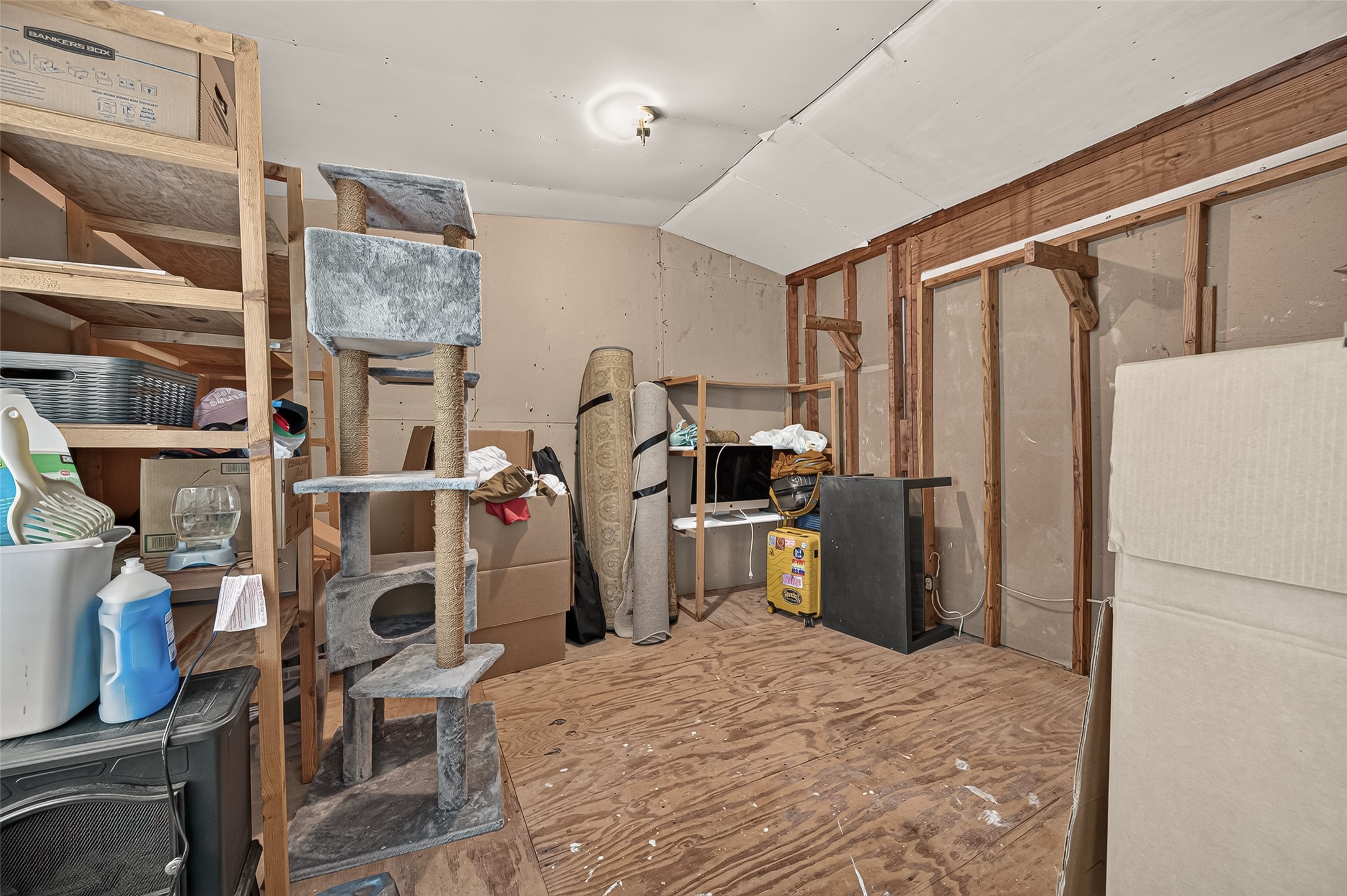 8007 Vickridge Lane Spring, TX 77379 - Photo 29 of 44 One of two walk in attic storage spaces off the flex room