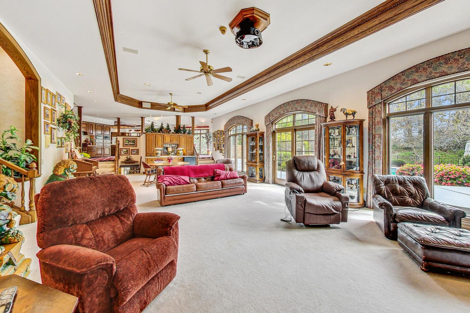 3S201 South Raddant Road Batavia, IL 60510 - Photo 11 of 58 a living room with furniture a couch and a chandelier