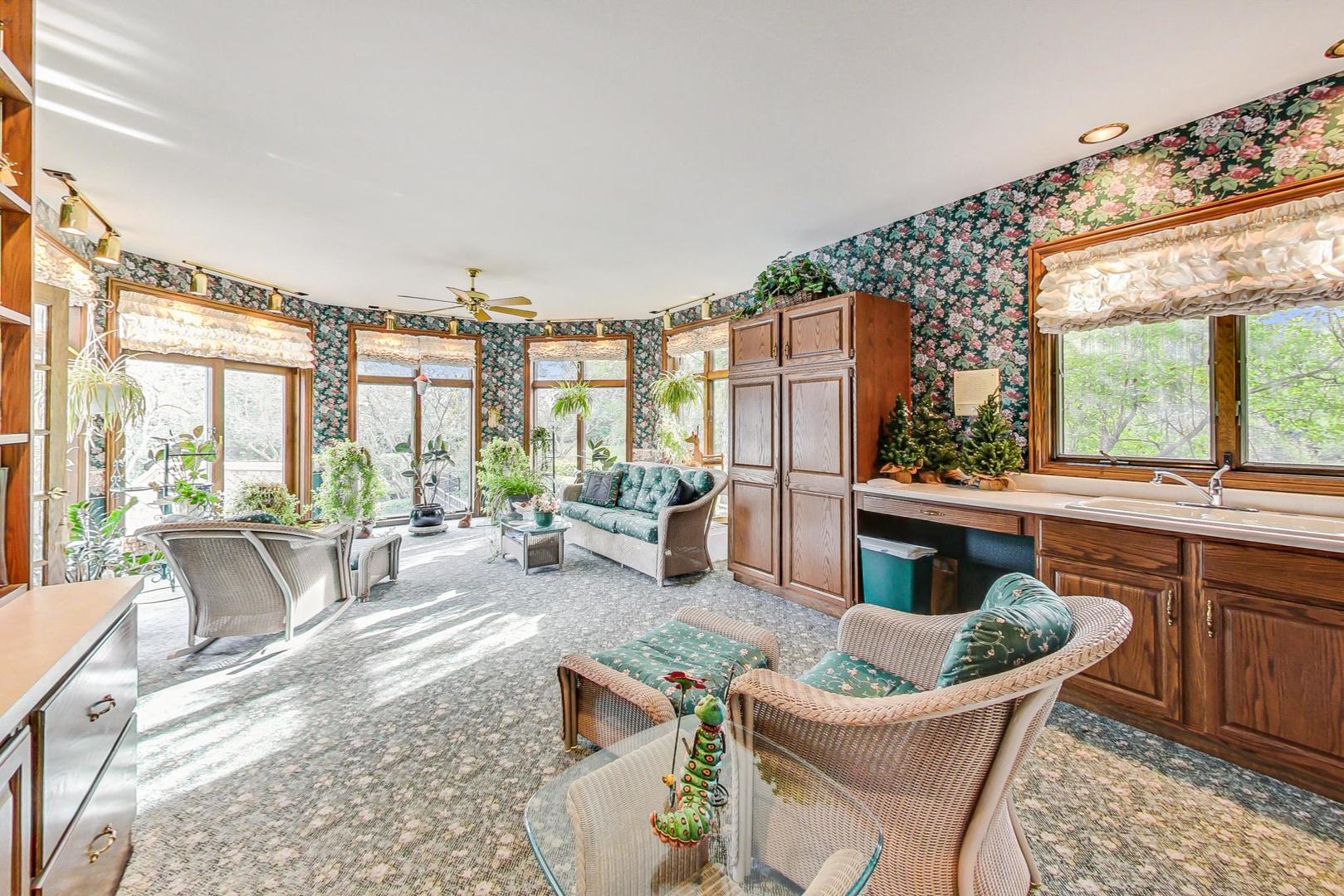 3S201 South Raddant Road Batavia, IL 60510 - Photo 17 of 58 a living room with fireplace furniture and a large window
