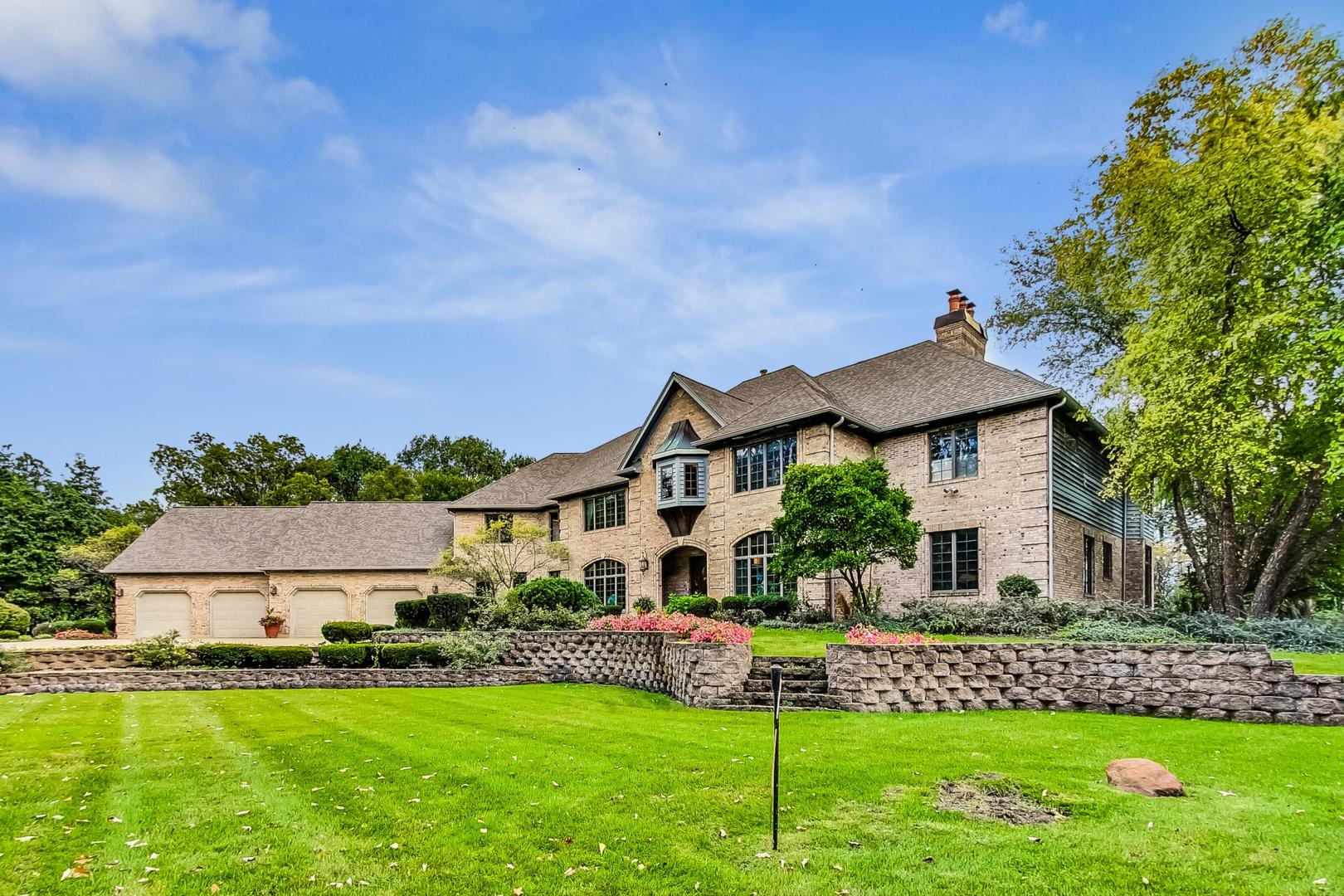 3S201 South Raddant Road Batavia, IL 60510 - Photo 2 of 58 a front view of a house with a yard and green space