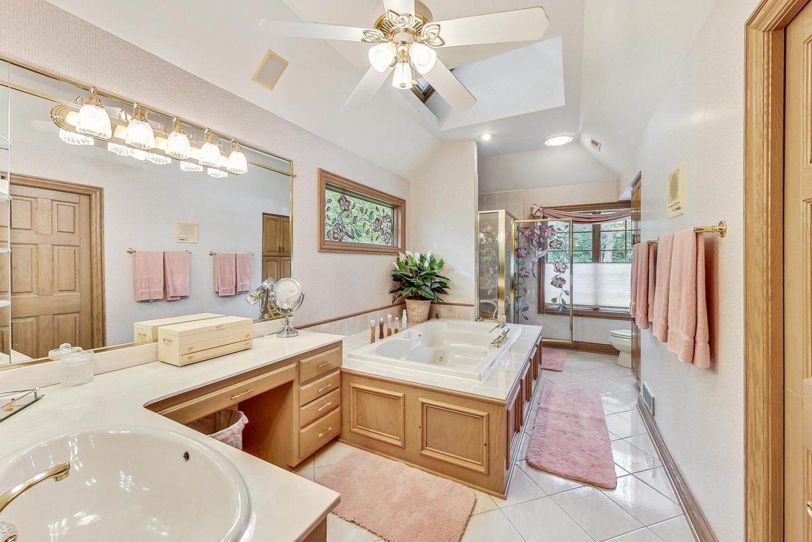 3S201 South Raddant Road Batavia, IL 60510 - Photo 25 of 58 a bathroom with a granite countertop sink and a large mirror