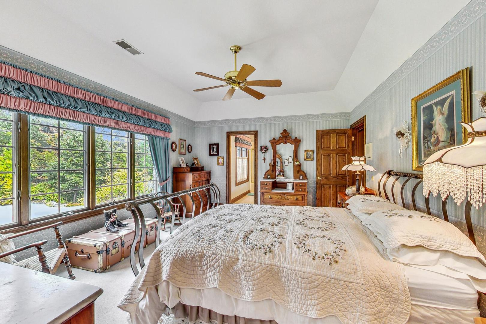 3S201 South Raddant Road Batavia, IL 60510 - Photo 30 of 58 a bed sitting in a bedroom next to a window