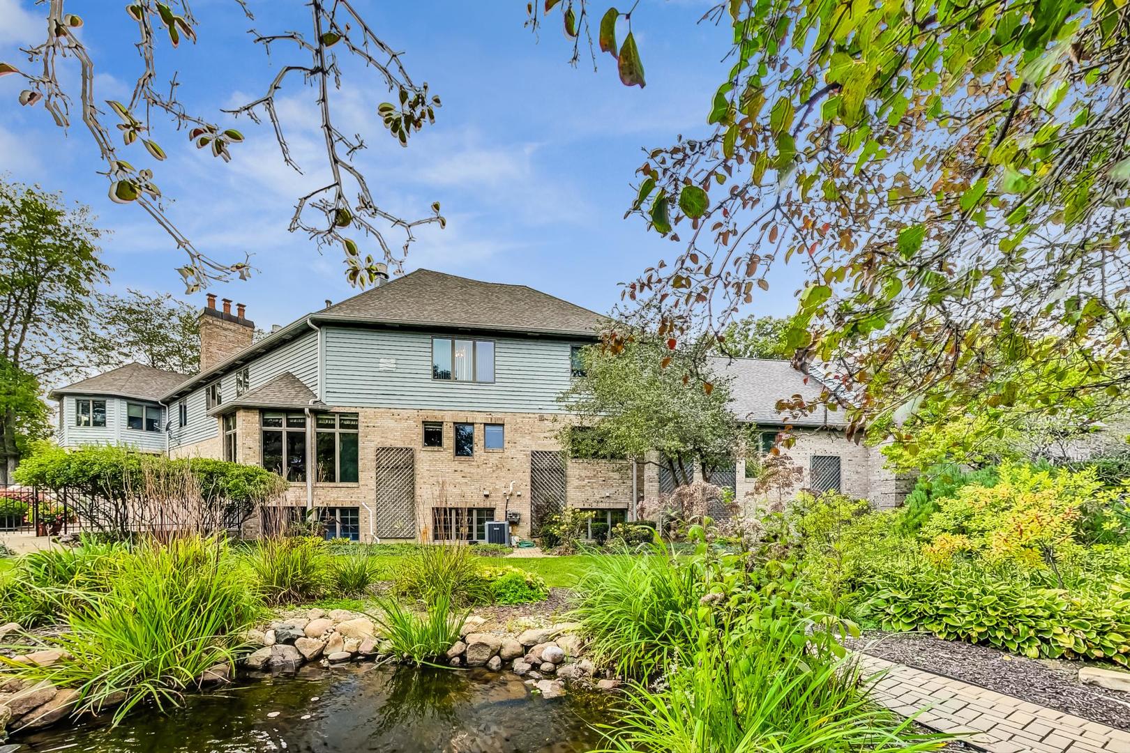 3S201 South Raddant Road Batavia, IL 60510 - Photo 48 of 58 a view of a white house with a yard and plants