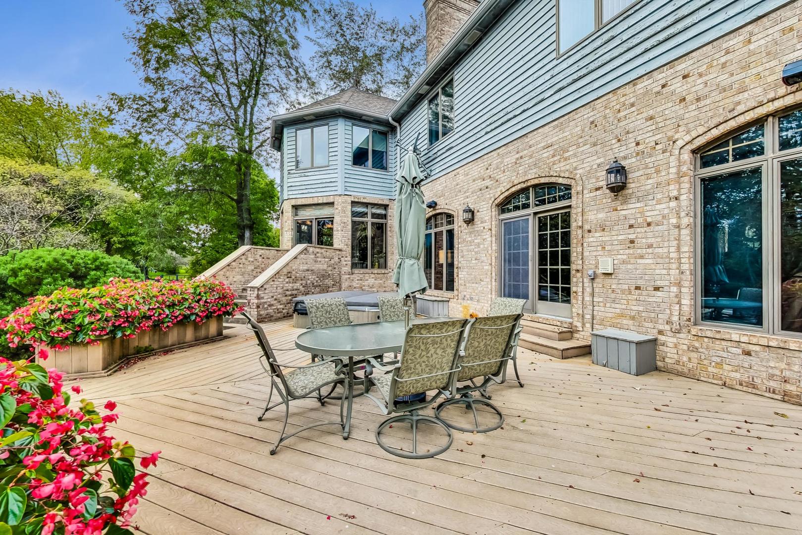 3S201 South Raddant Road Batavia, IL 60510 - Photo 49 of 58 a view of a patio with table and chairs and potted plants
