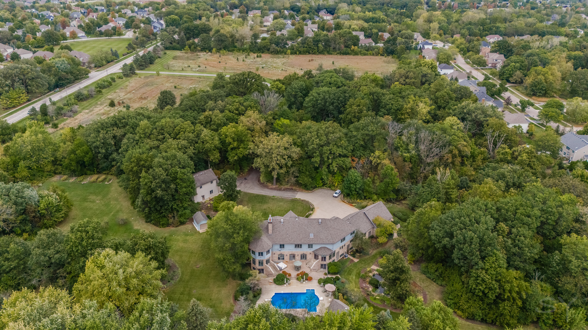 3S201 South Raddant Road Batavia, IL 60510 - Photo 5 of 58 an aerial view of residential houses with outdoor space and trees