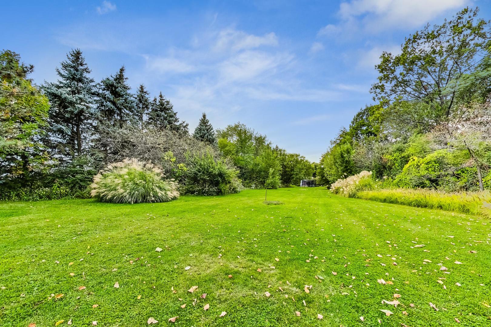 3S201 South Raddant Road Batavia, IL 60510 - Photo 55 of 58 a view of a big yard with plants and large trees