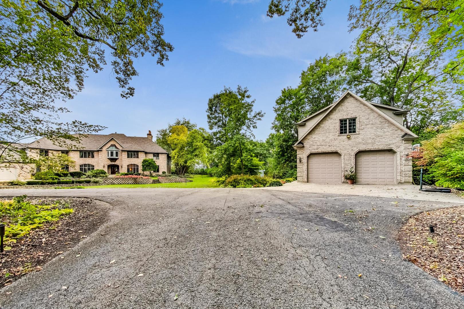 3S201 South Raddant Road Batavia, IL 60510 - Photo 57 of 58 a front view of a house with a yard and garage