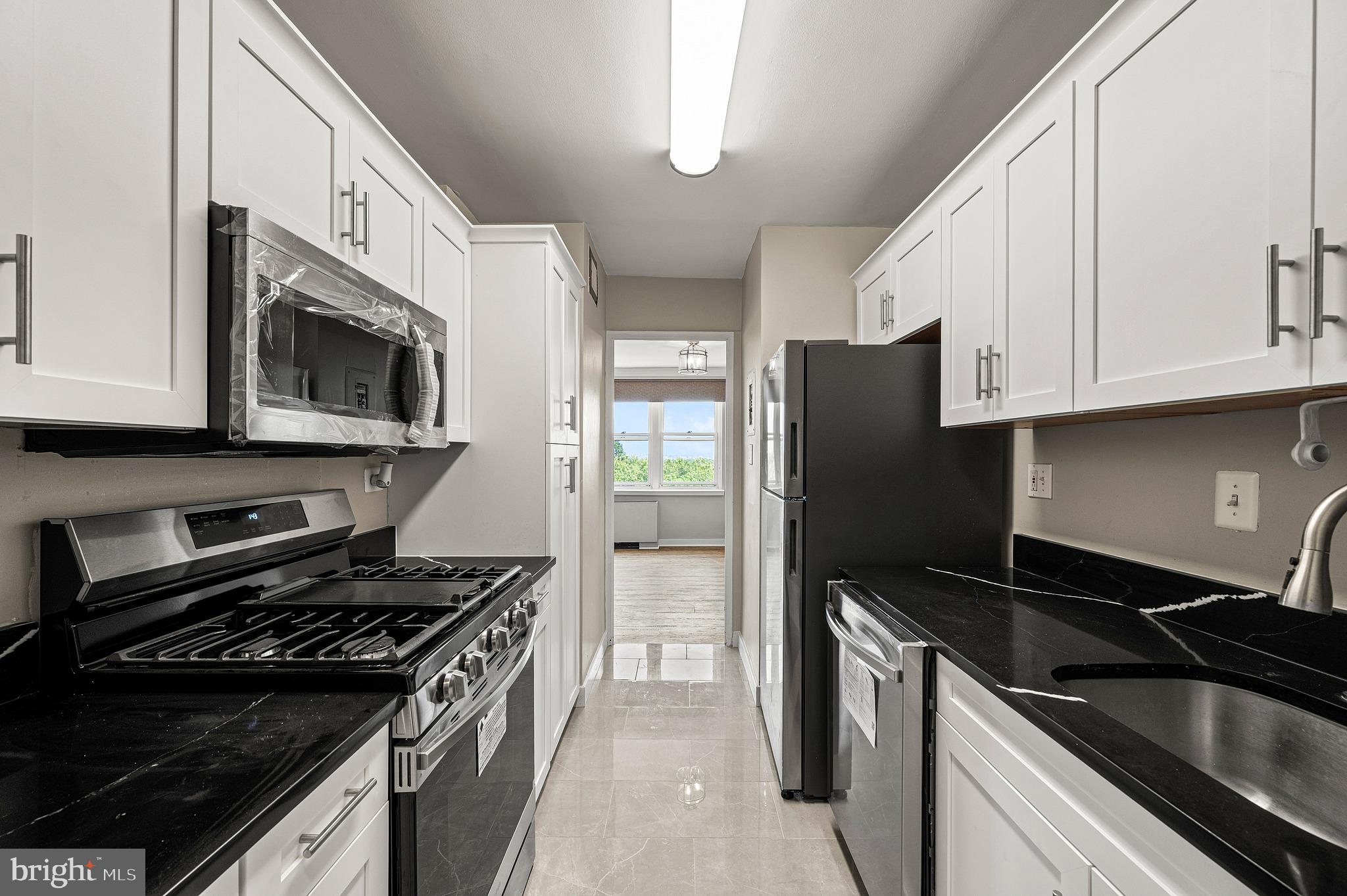 1600 Hagys Ford Road North, Unit 9N Penn Valley, PA 19072 - Photo 12 of 37 Clean modern kitchen new appliances