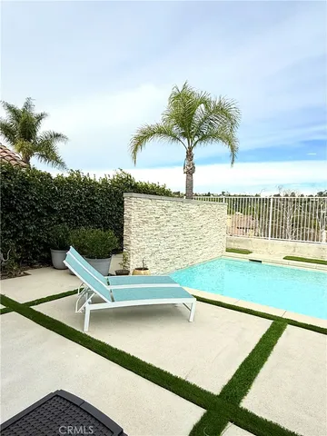 a view of swimming pool with chairs