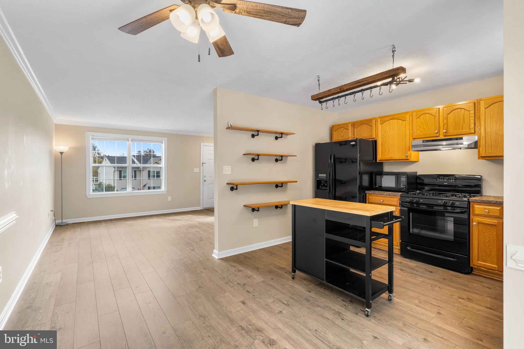 3836 Dakota Road Hampstead, MD 21074 - Photo 11 of 47 a kitchen with stainless steel appliances granite countertop a stove and a refrigerator
