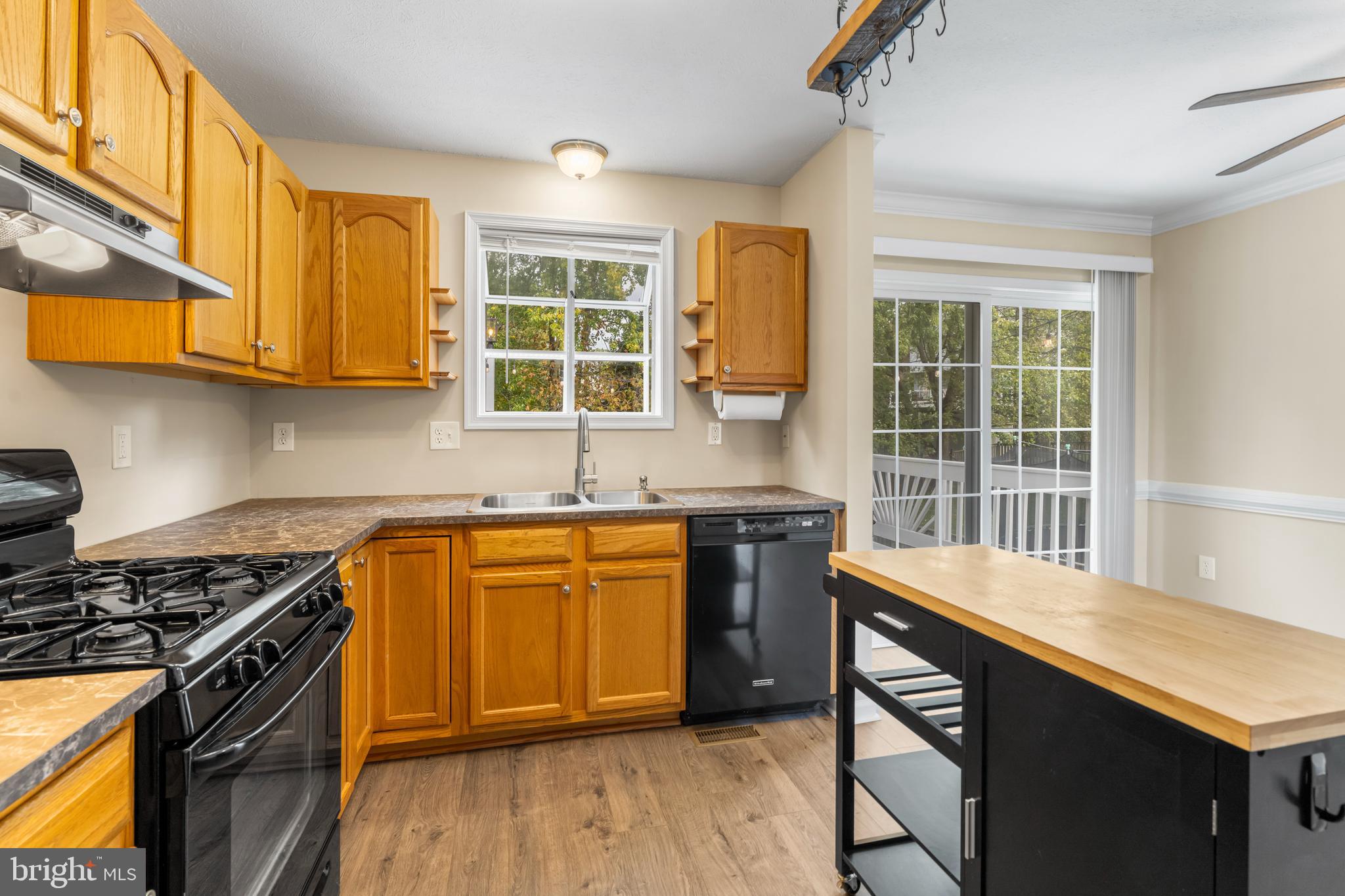 3836 Dakota Road Hampstead, MD 21074 - Photo 14 of 47 a kitchen with stainless steel appliances granite countertop a stove a sink and a microwave