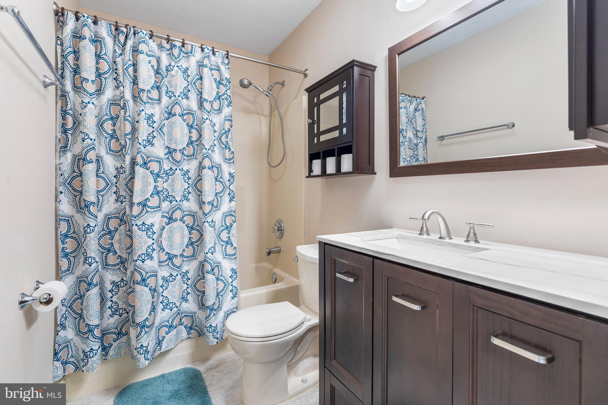 3836 Dakota Road Hampstead, MD 21074 - Photo 18 of 47 a bathroom with a granite countertop toilet sink and mirror
