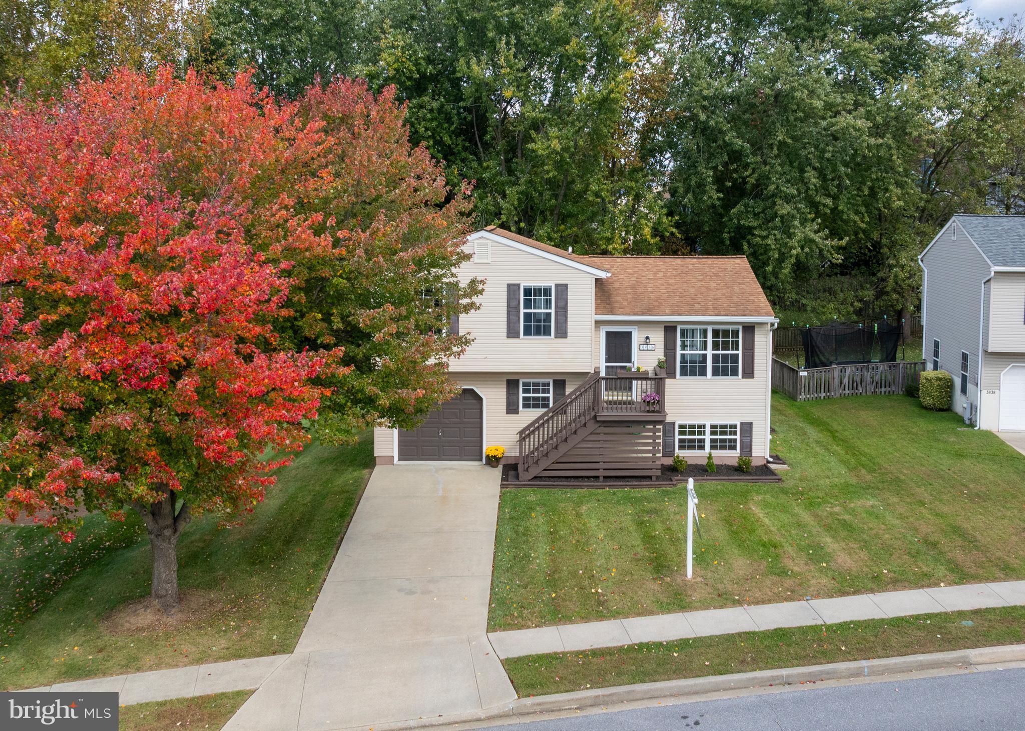 3836 Dakota Road Hampstead, MD 21074 - Photo 35 of 47 a view of a house with a backyard porch and sitting area