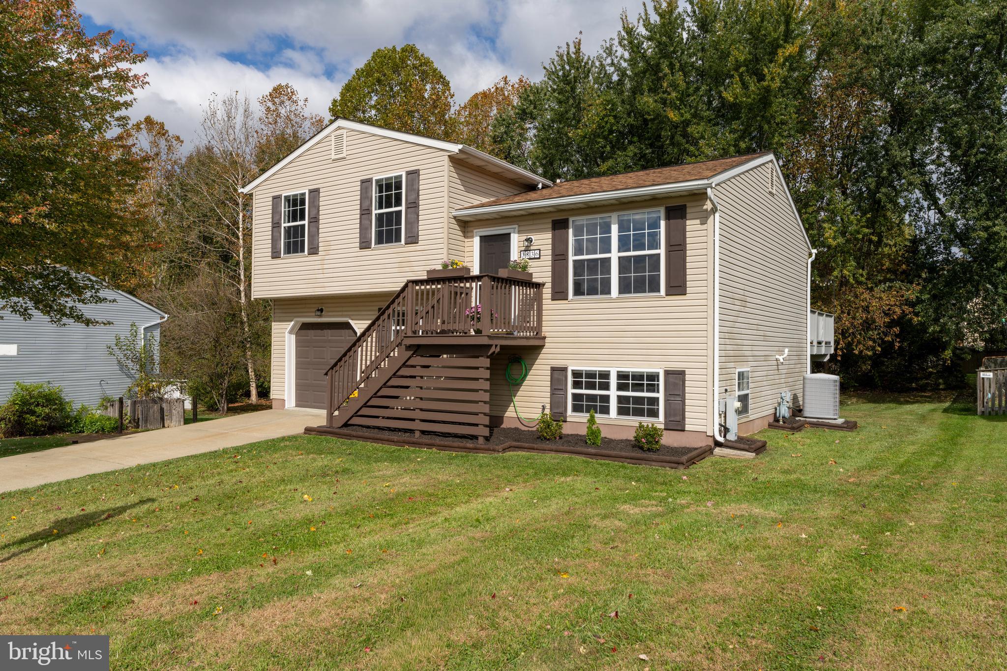 3836 Dakota Road Hampstead, MD 21074 - Photo 4 of 47 a front view of a house with a yard