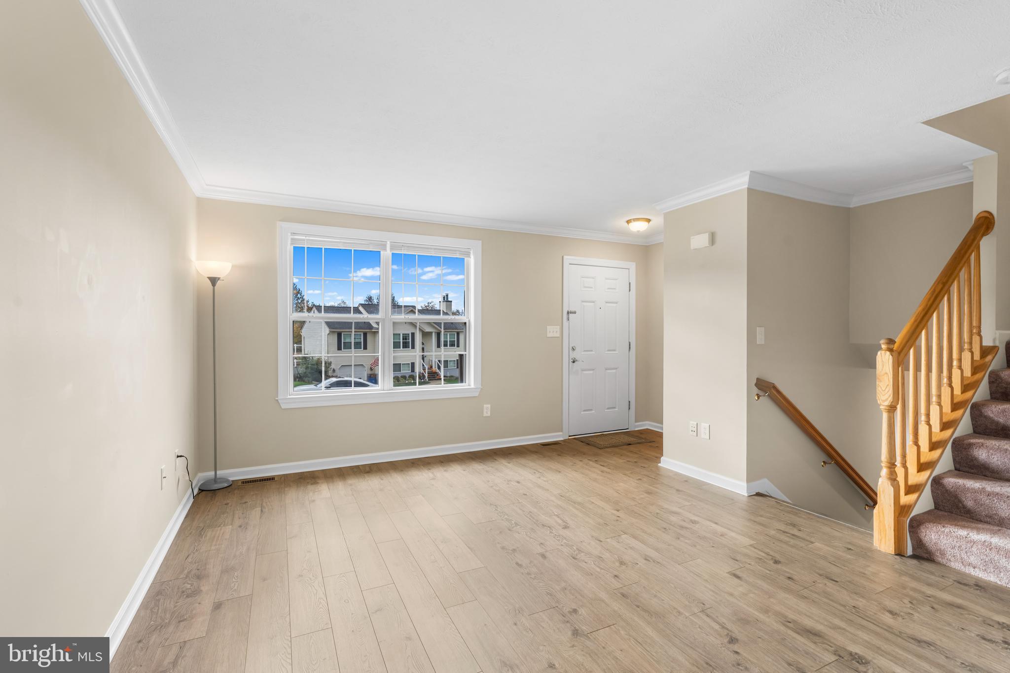 3836 Dakota Road Hampstead, MD 21074 - Photo 8 of 47 a view of an empty room with wooden floor and a window