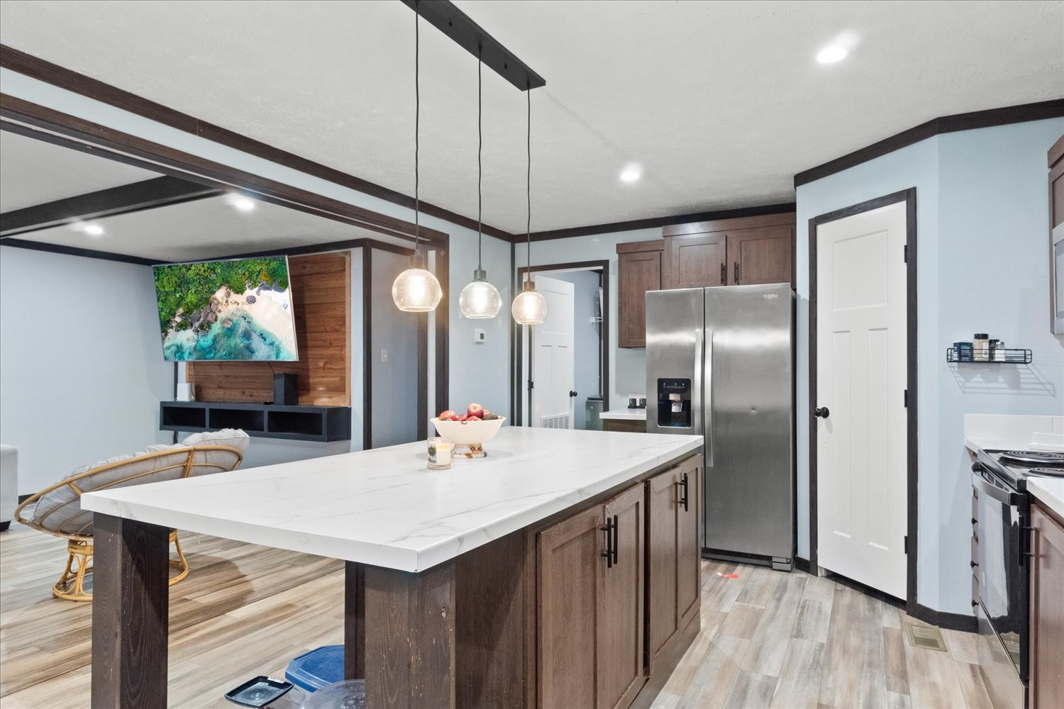 1416 South High Street Columbia, TN 38401 - Photo 11 of 24 a kitchen with stainless steel appliances kitchen island granite countertop a table chairs refrigerator and wooden floor