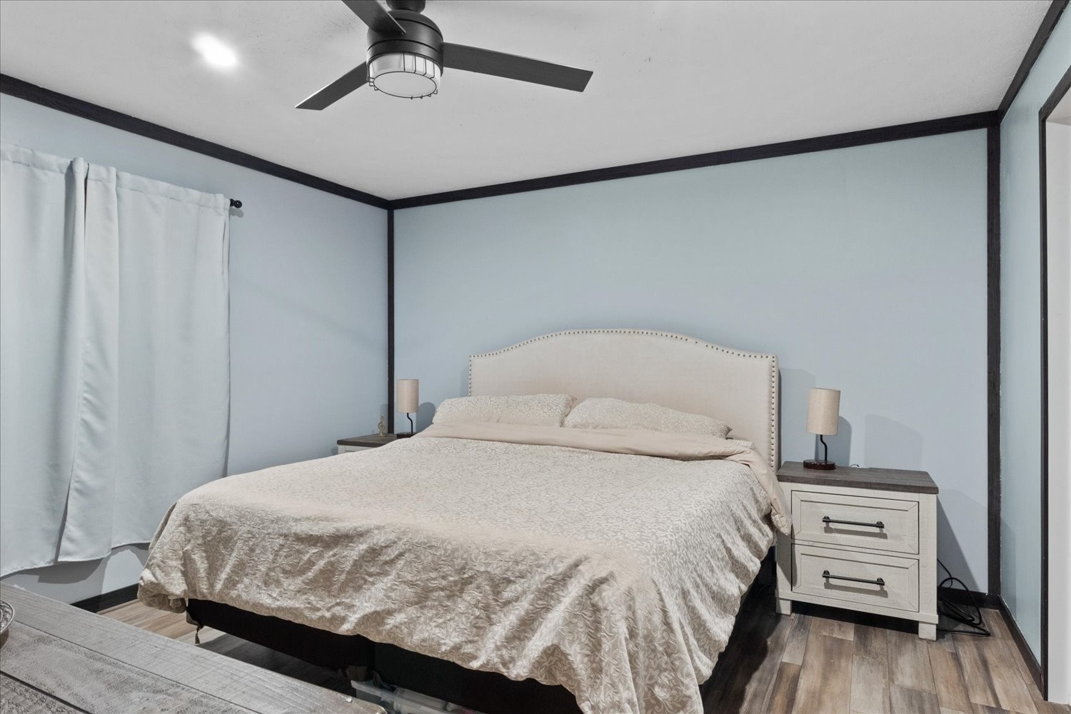 1416 South High Street Columbia, TN 38401 - Photo 13 of 24 a bedroom with a bed and a chandelier