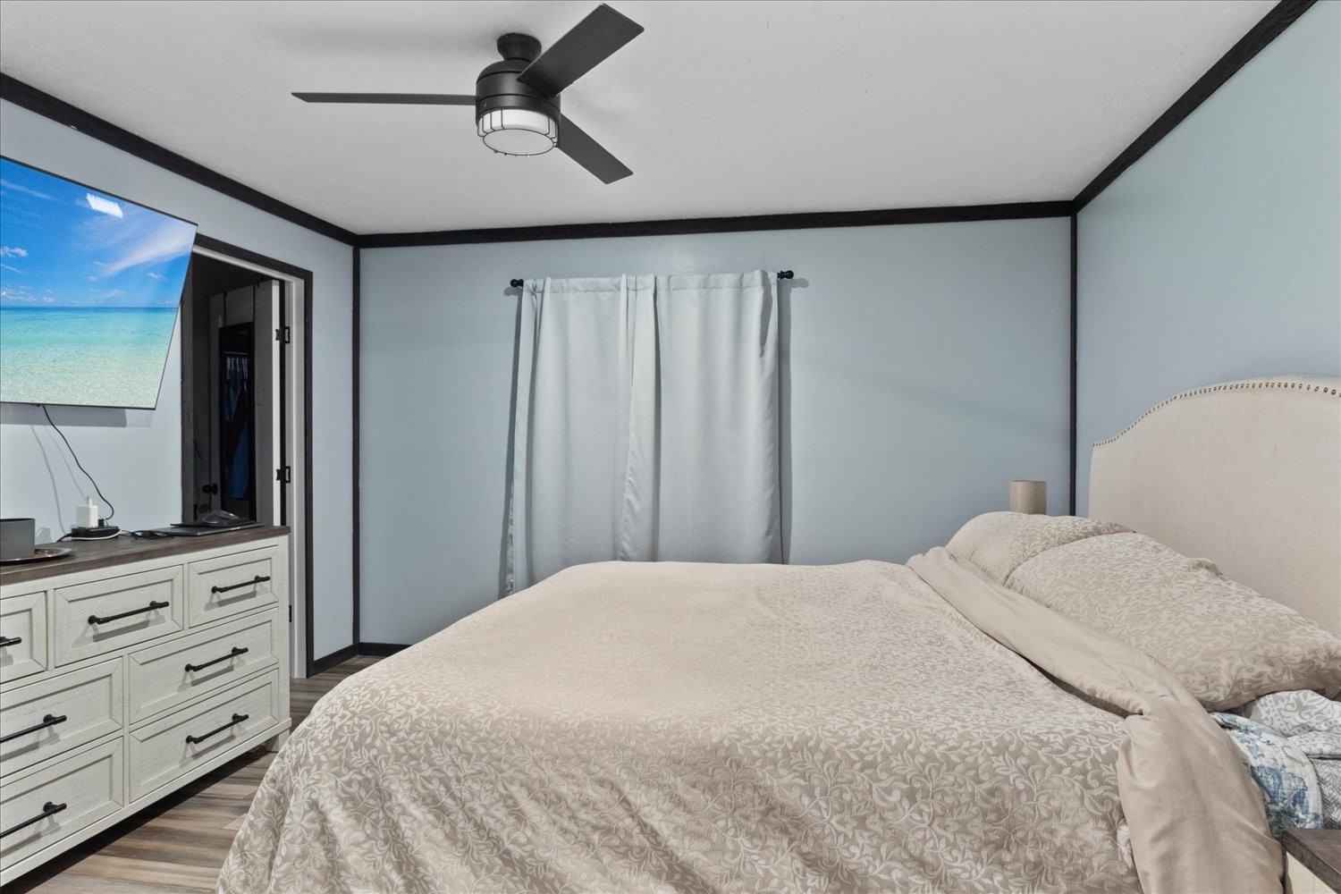 1416 South High Street Columbia, TN 38401 - Photo 14 of 24 a bedroom with a bed and a flat screen tv