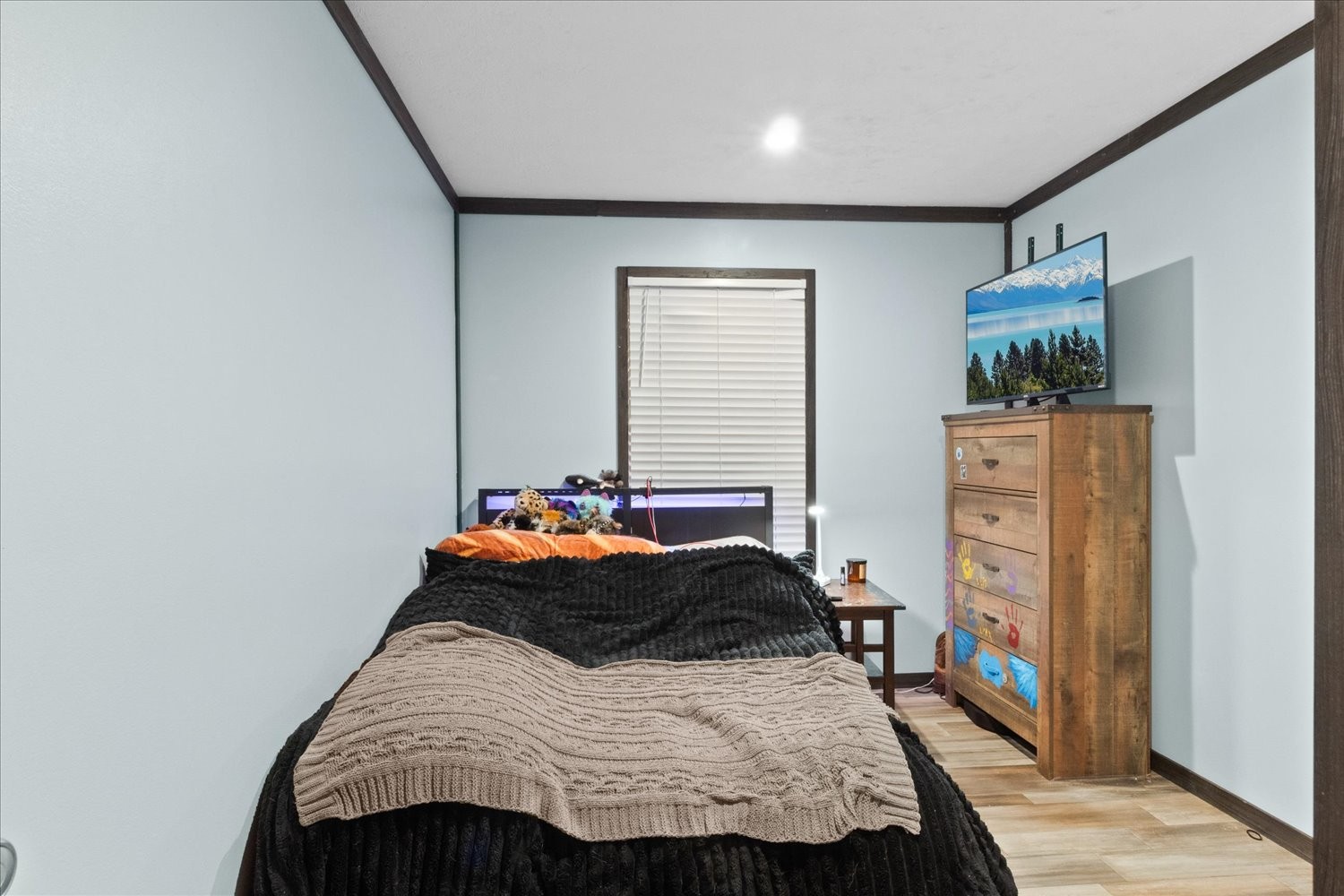 1416 South High Street Columbia, TN 38401 - Photo 19 of 24 a bedroom with a bed and a flat tv screen on the dresser