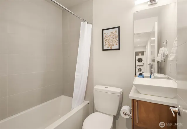 a white toilet sitting next to a bath tub shower