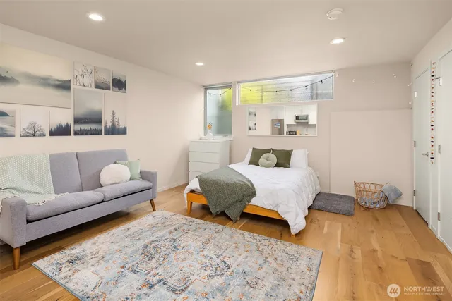 a bedroom with a bed and a couch