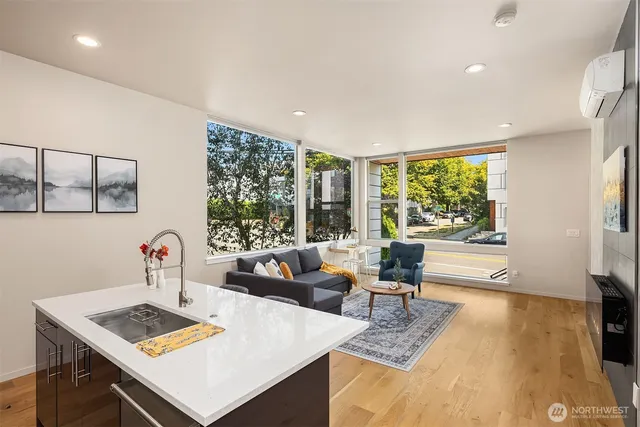 a living room with furniture and next to a window