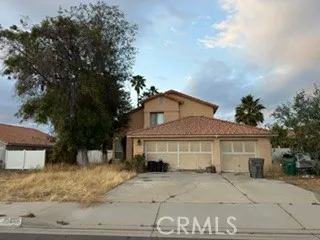 a front view of a house with a garage