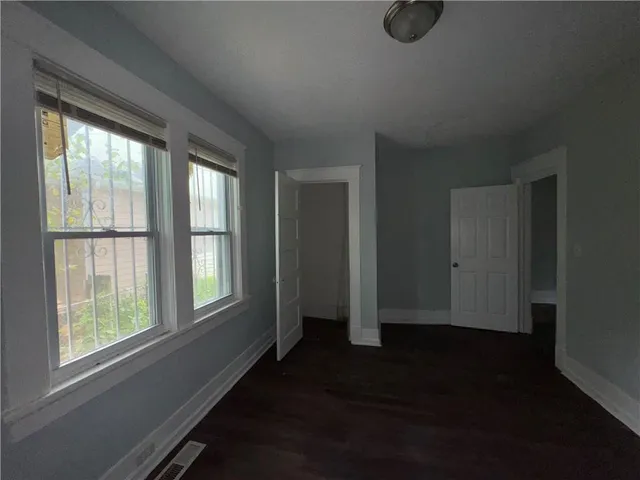 an empty room with windows