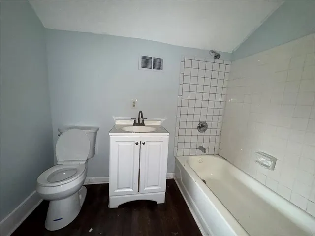 a bathroom with a toilet sink and bathtub