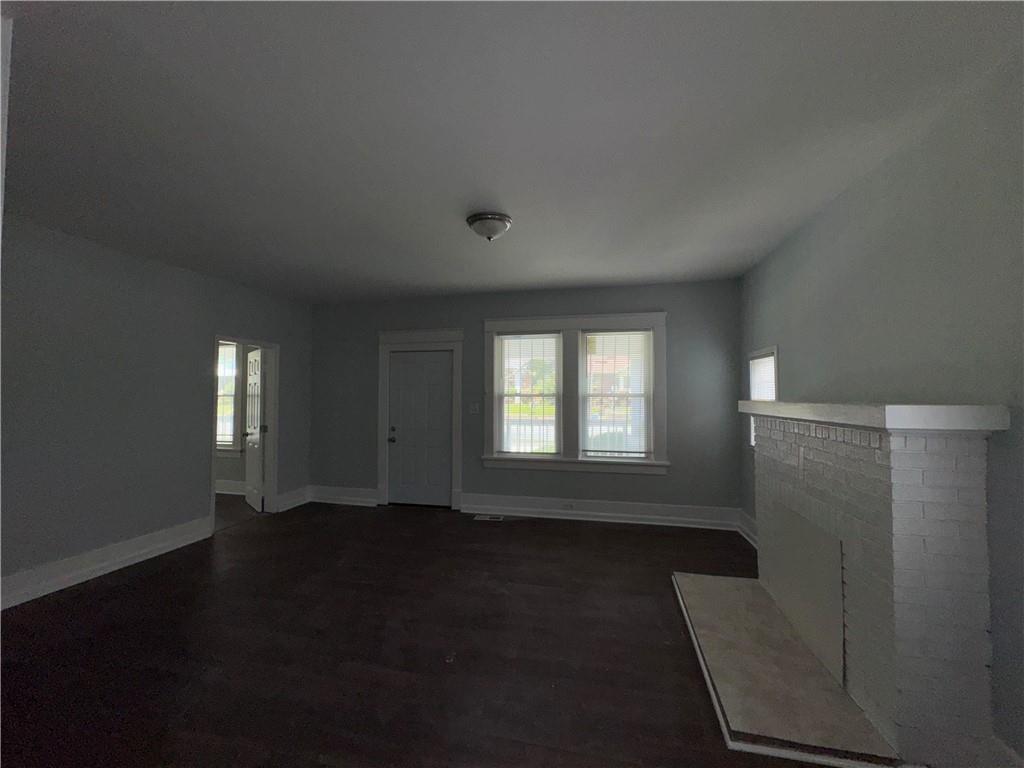 1462 Lucile Avenue Southwest Atlanta, GA 30310 - Photo 6 of 22 an empty room with wooden floor and windows