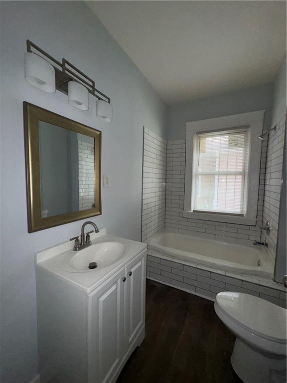 1462 Lucile Avenue Southwest Atlanta, GA 30310 - Photo 10 of 22 a bathroom with a sink a toilet and tub
