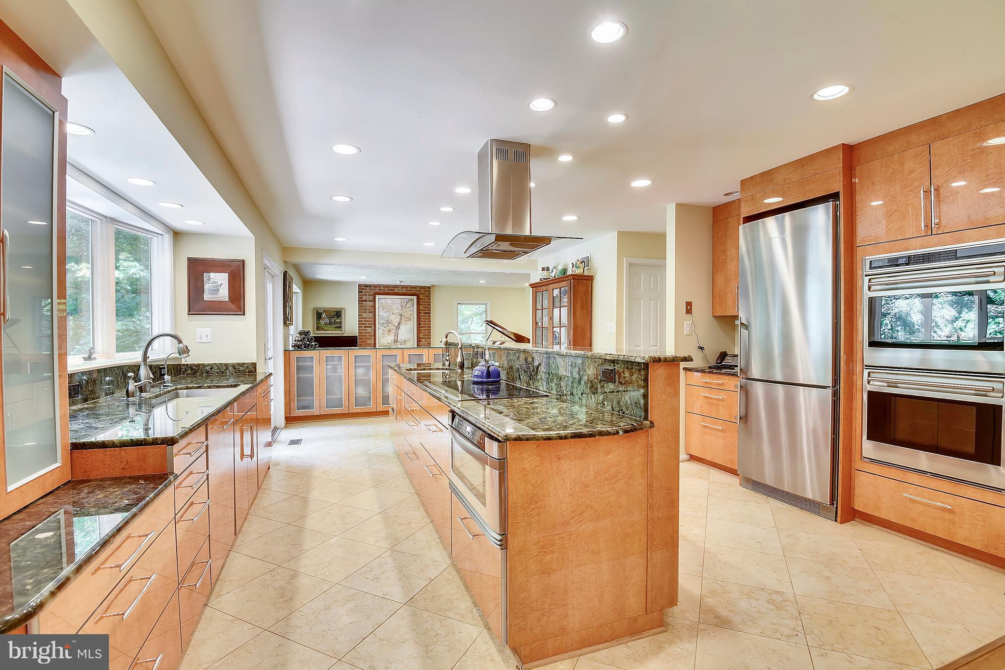 11692 Bennington Woods Road Reston, VA 20194 - Photo 2 of 29 a kitchen with stainless steel appliances granite countertop a refrigerator and a stove