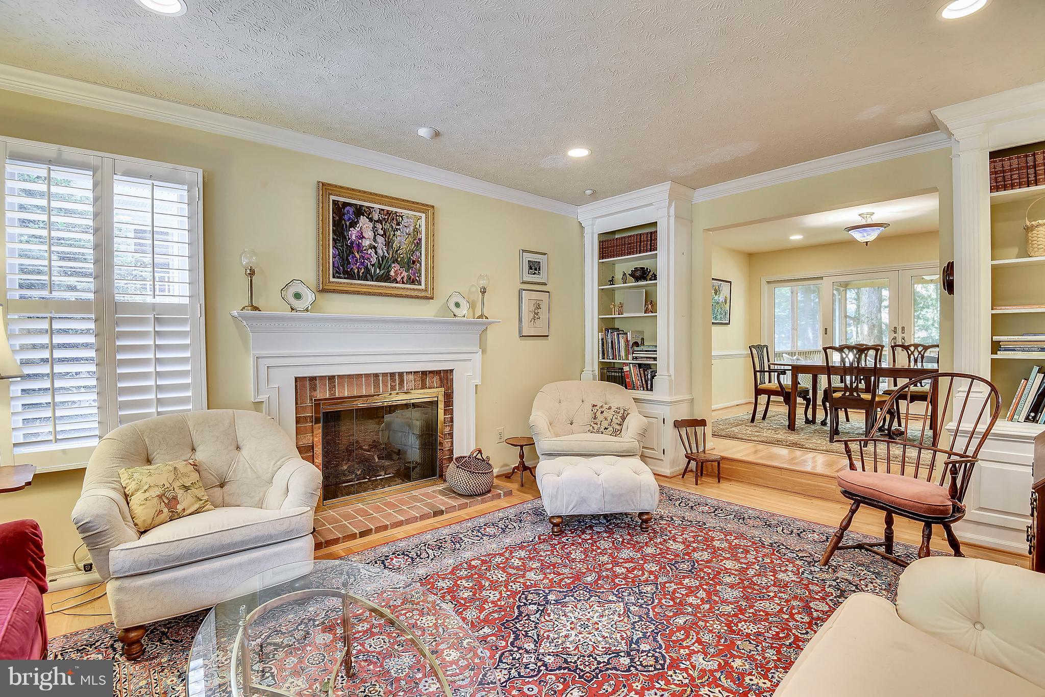 11692 Bennington Woods Road Reston, VA 20194 - Photo 12 of 29 a living room with furniture and a fireplace