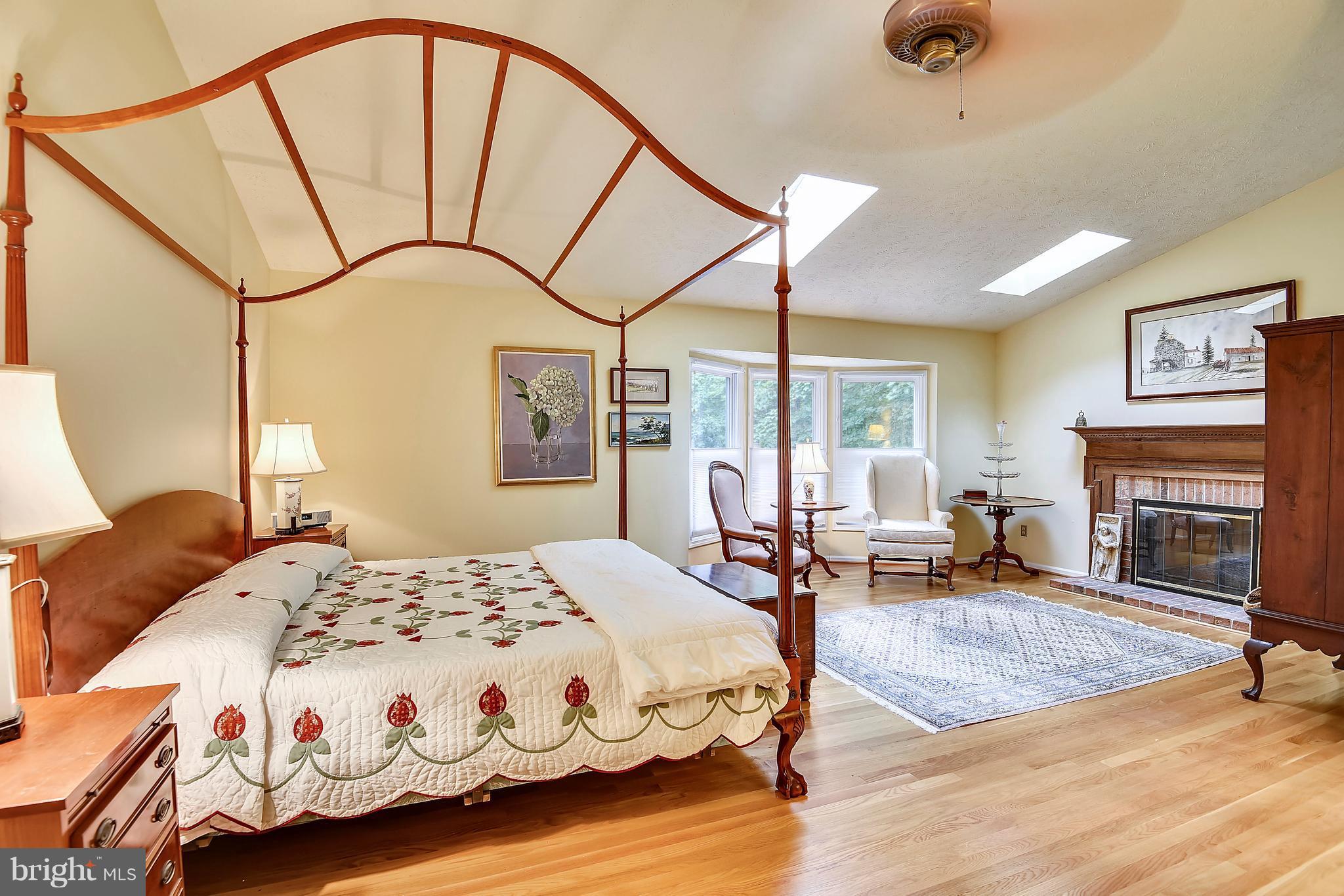 11692 Bennington Woods Road Reston, VA 20194 - Photo 13 of 29 a bedroom with a bed a table and chair