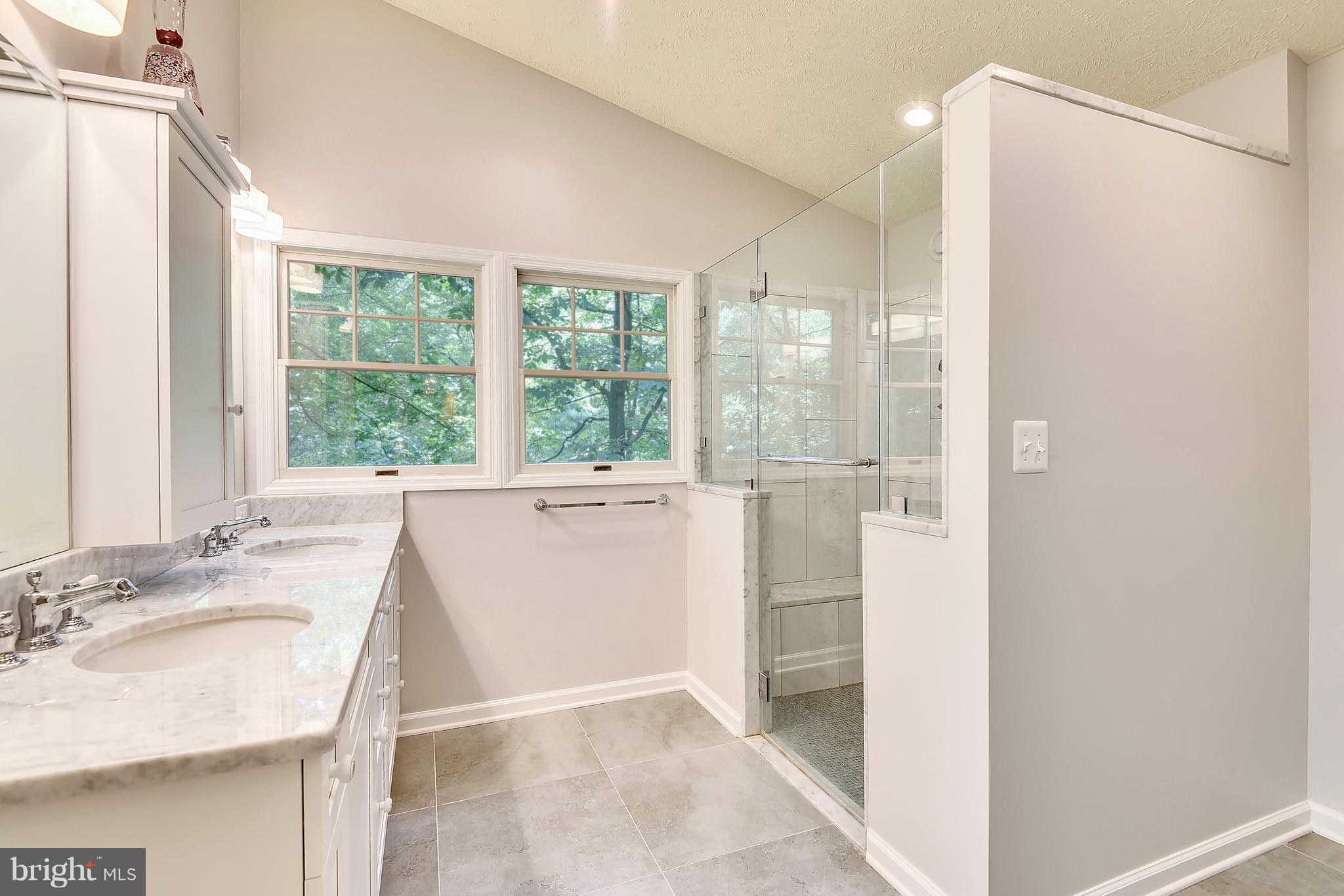 11692 Bennington Woods Road Reston, VA 20194 - Photo 16 of 29 a bathroom with a granite countertop sink and a mirror