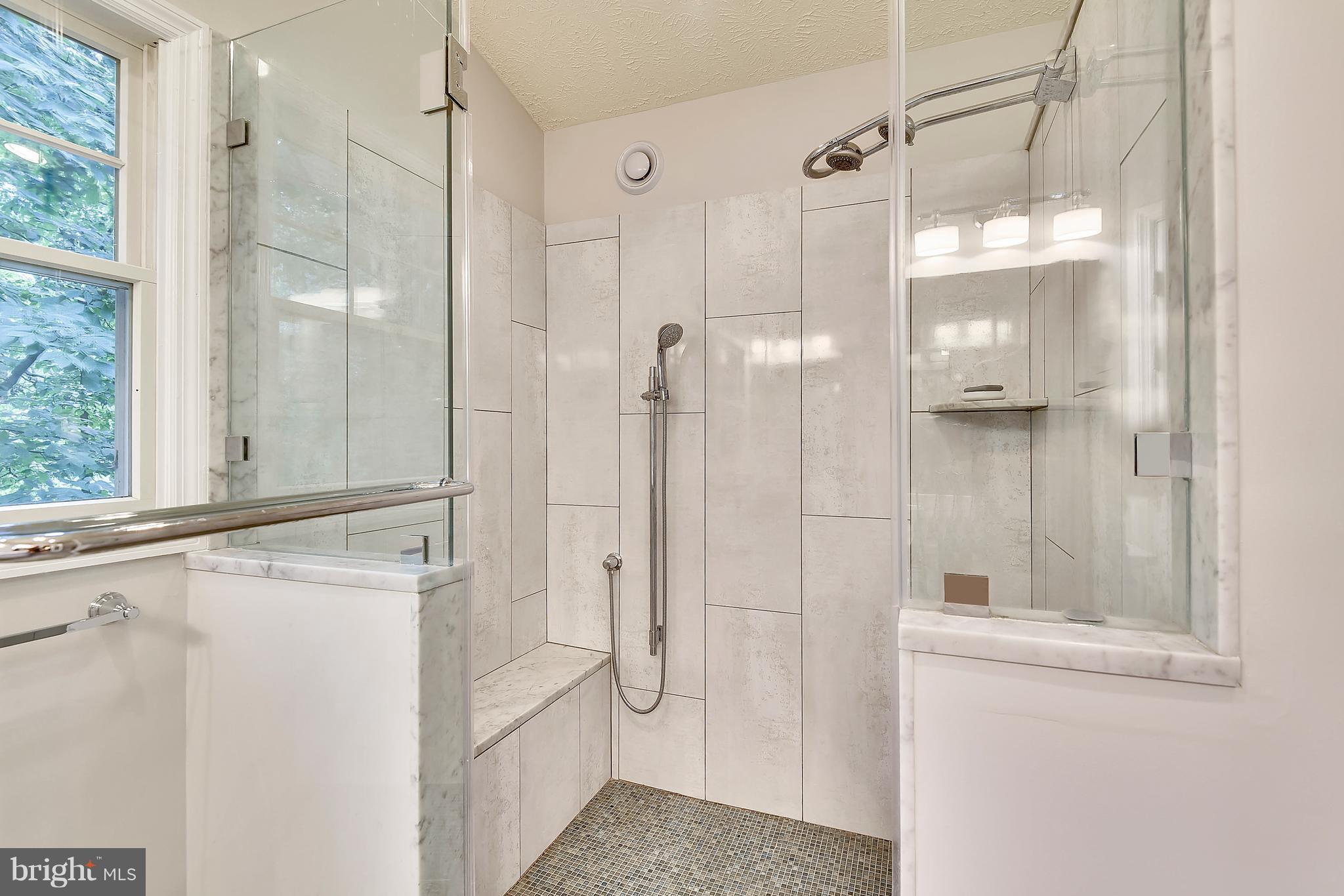 11692 Bennington Woods Road Reston, VA 20194 - Photo 17 of 29 a bathroom with a shower and a sink