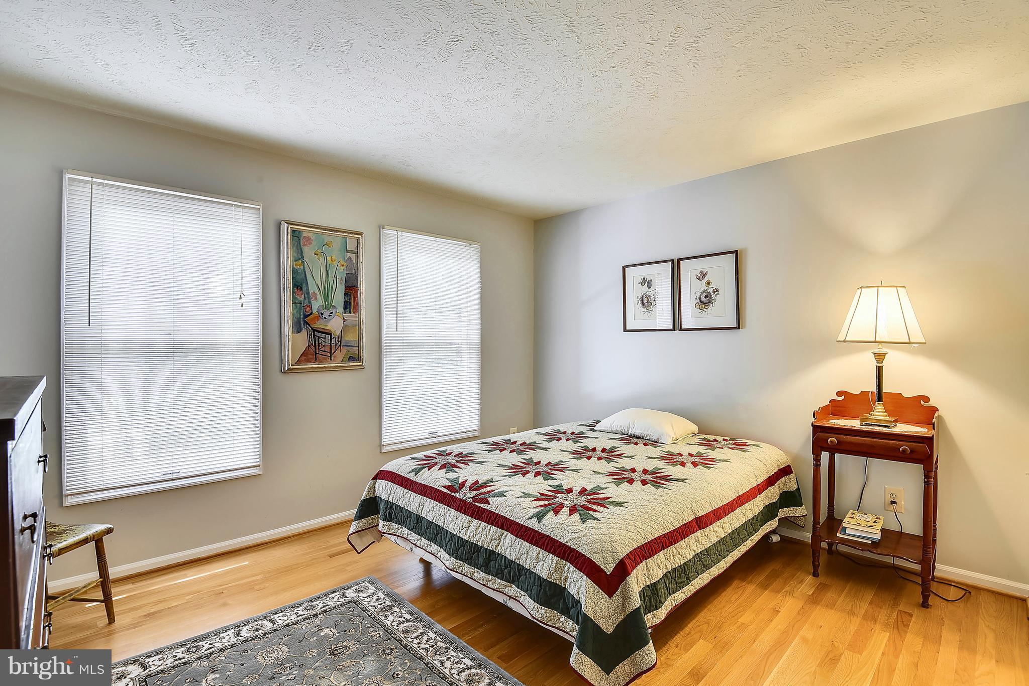 11692 Bennington Woods Road Reston, VA 20194 - Photo 22 of 29 a bedroom with a bed and a window