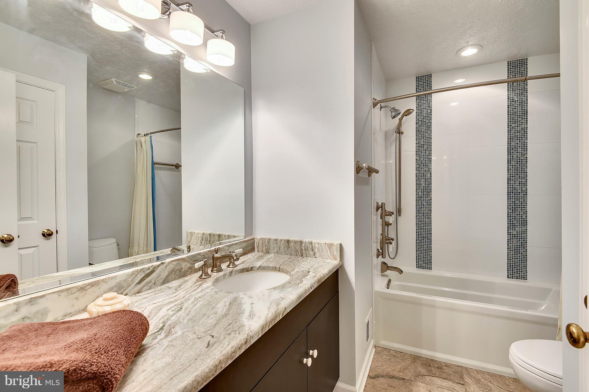 11692 Bennington Woods Road Reston, VA 20194 - Photo 23 of 29 a bathroom with a granite countertop double vanity sink and a mirror