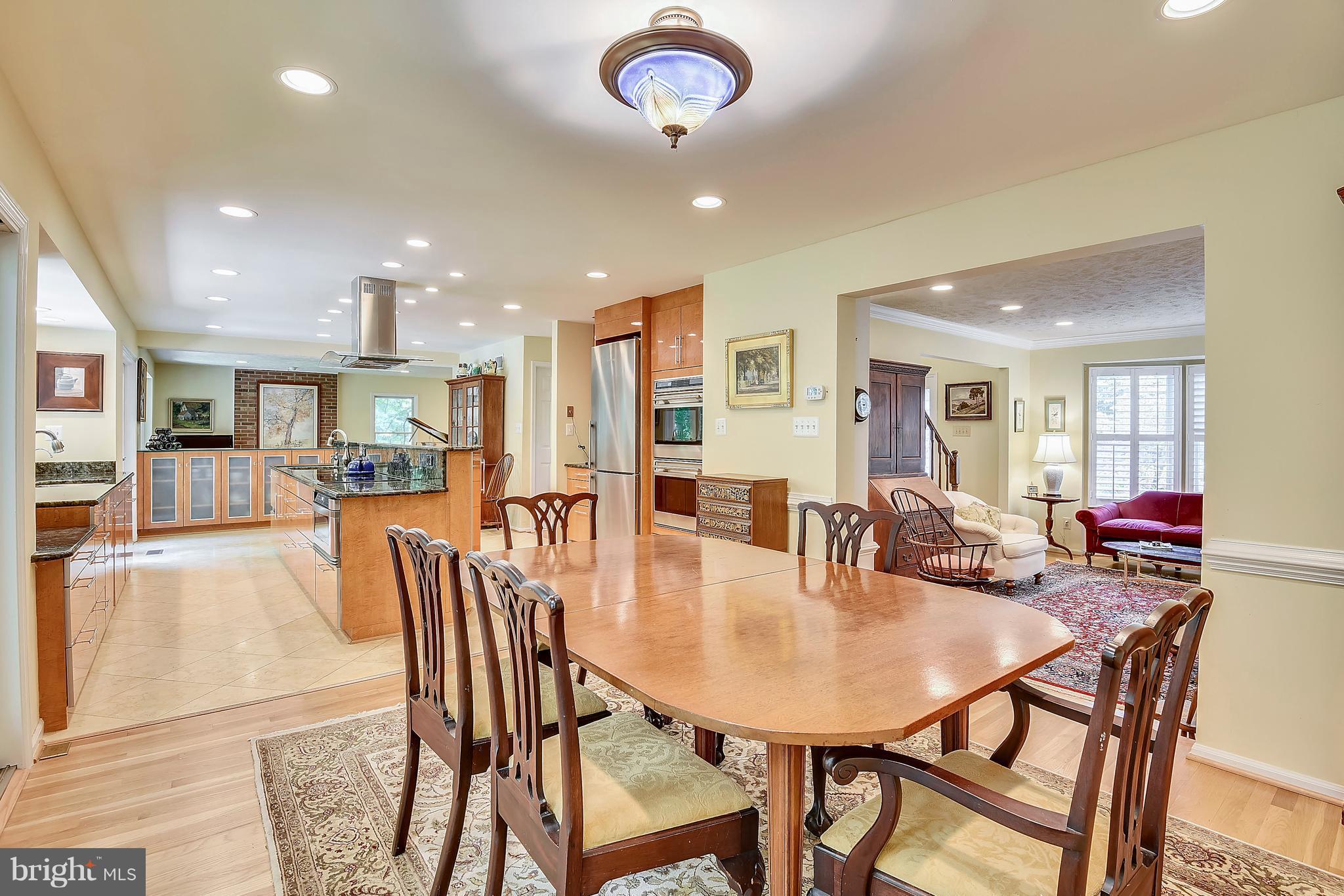 11692 Bennington Woods Road Reston, VA 20194 - Photo 5 of 29 a view of a dining area with furniture and a potted plant